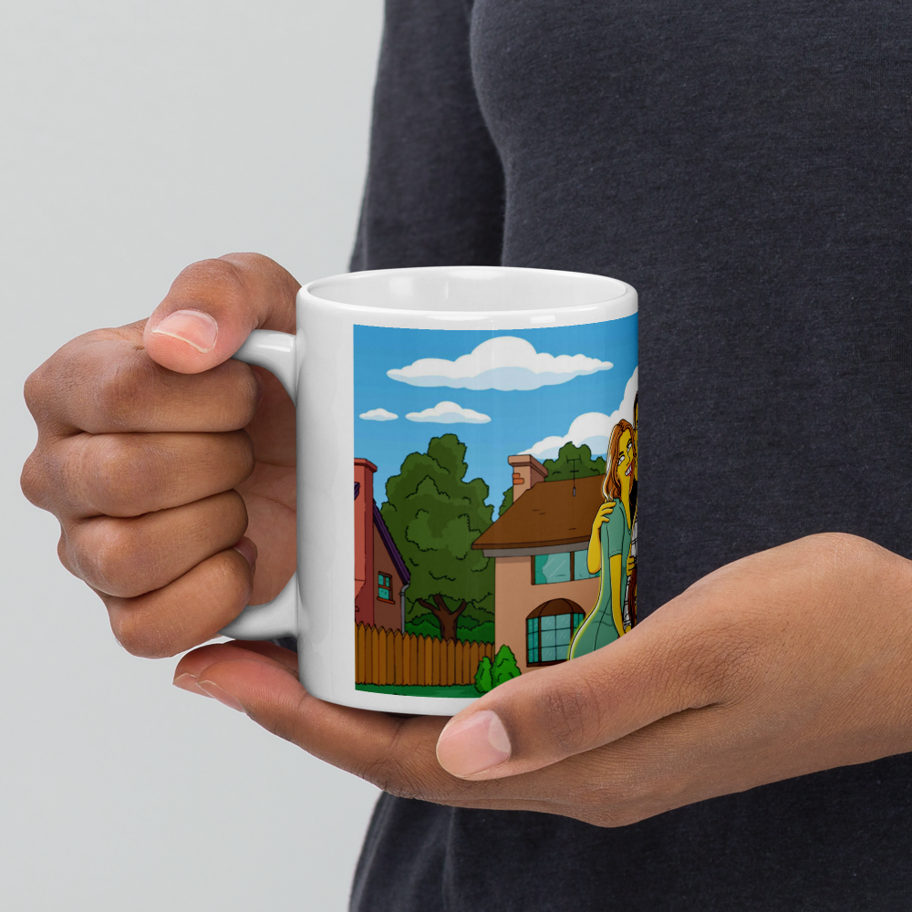 Personalized Simpsons mug showcasing a custom Simpsonized portrait of a couple against a Springfield-inspired backdrop.