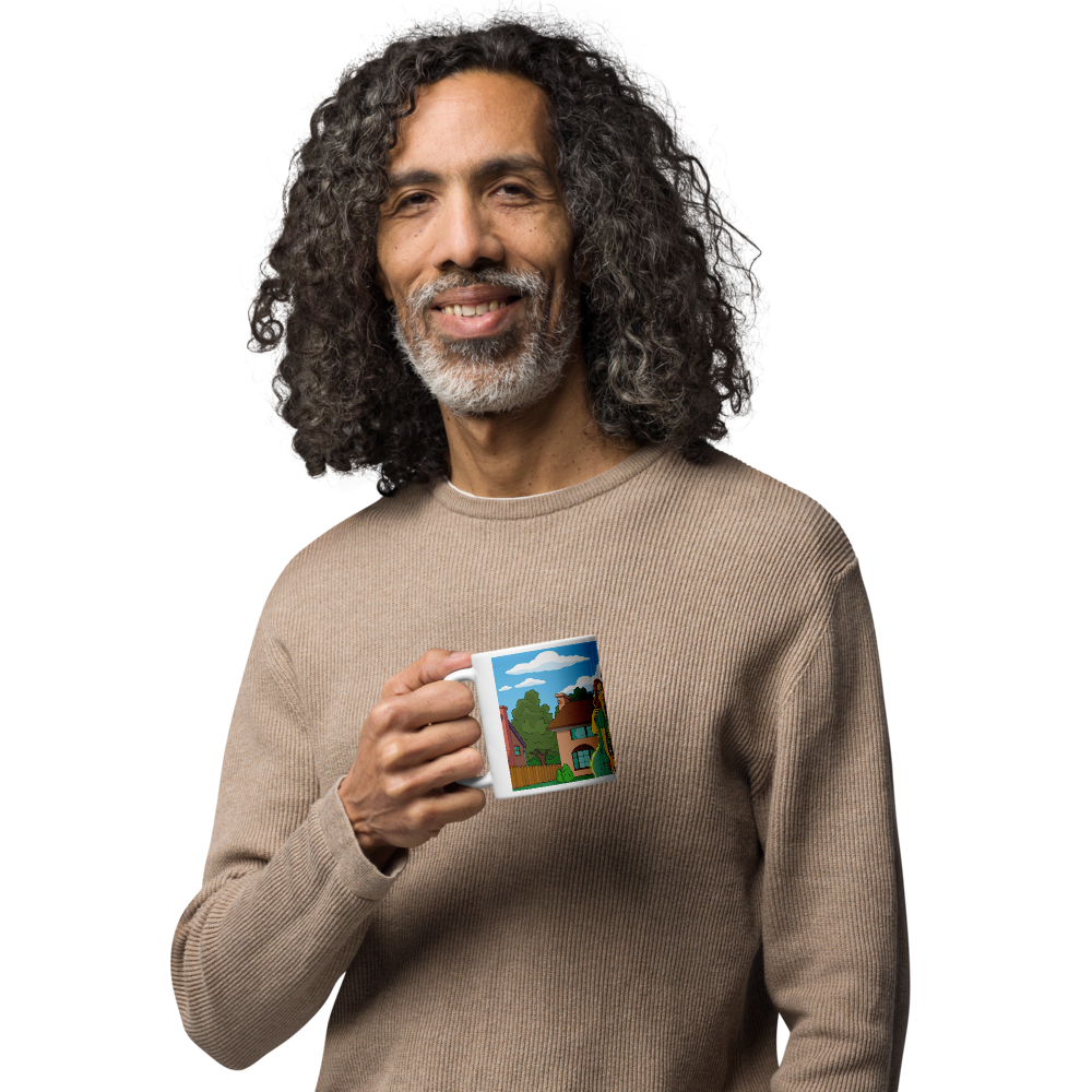 Personalized Simpsons mug featuring a custom house illustration. Man holding and displaying the custom mug with his home.
