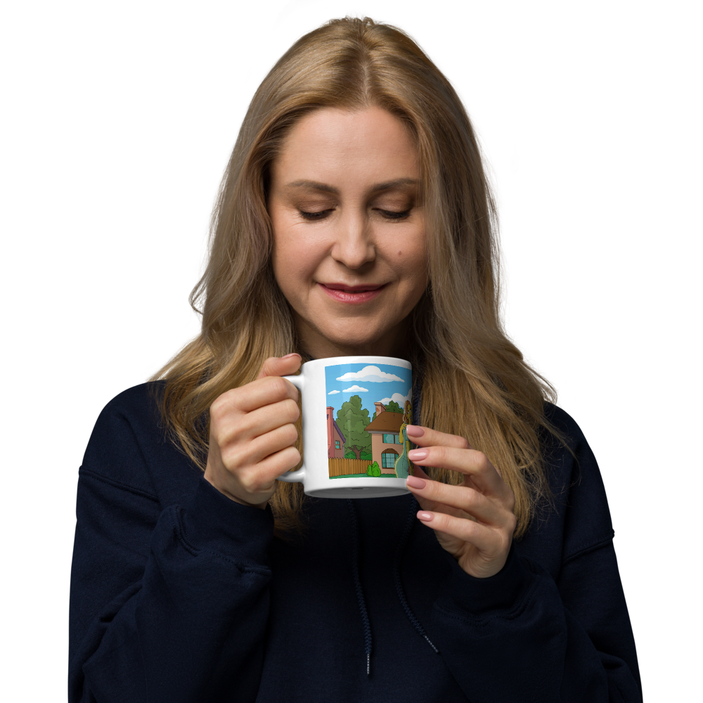 Woman holding a Simpsons mug featuring a cartoon suburban house design. Unique coffee mug.