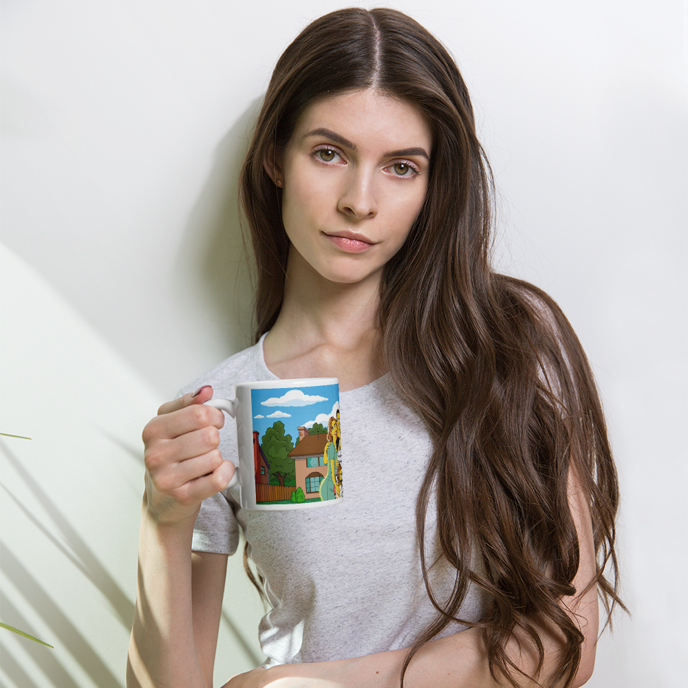 Woman holds a custom Simpsons mug featuring a cartoon drawing of the iconic house and family.